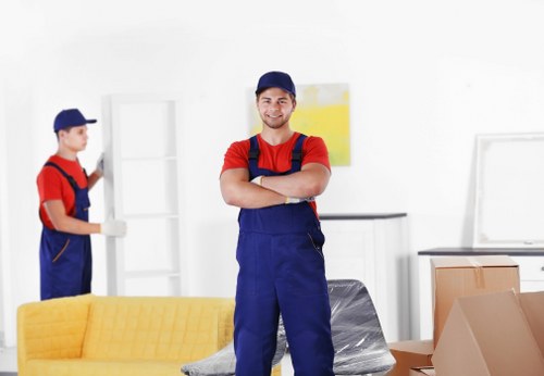 House clearance team organizing items in Epping home