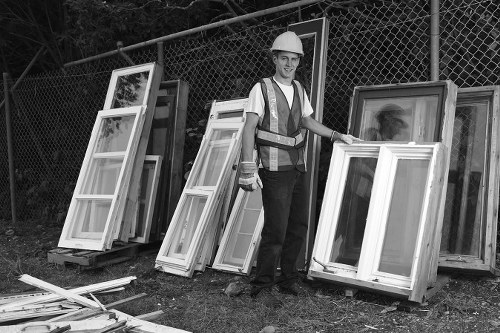 Bulk waste collection professionals removing large items from a home