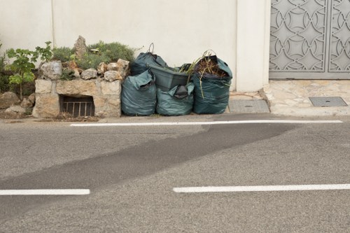 Workers managing building waste during clearance